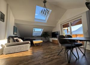 a living room with a table and a couch at Au 10 in St. Wolfgang