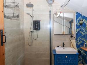 a bathroom with a sink and a shower at Park Cottage in Kingsbridge +35 photos