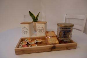 a wooden tray filled with different types of food at La Casa del Borgo in Rieti +29 photos