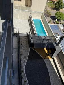 an overhead view of a house with a swimming pool at Mono 611 in Neuquén