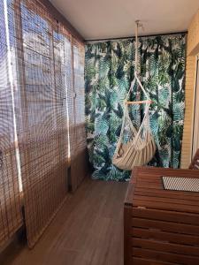 a hallway with a room with a hammock on the wall at Costa Dream Stay in Torrevieja