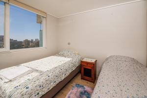 En eller flere senge i et værelse på Bello Departamento2 Centro Viña Mar, 2Dormitorios
