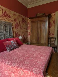 a bedroom with a large bed with a red blanket at Le Clos de La Chardonnière in Saulce-sur-Rhône +32 photos