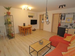 a living room with a couch and a table at elfA-partment in Schwanstetten