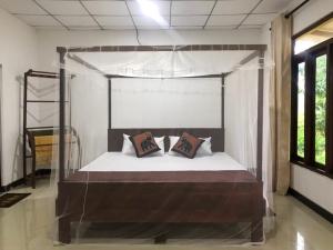 Giường trong phòng chung tại Paddy Field View Lodge Sigiriya +16 ảnh