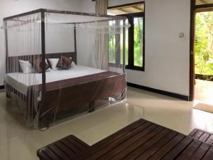 Giường trong phòng chung tại Paddy Field View Lodge Sigiriya