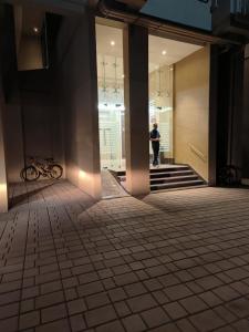 a person standing in a hallway of a building at Riyas stay in Mumbai