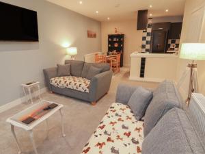 a living room with a couch and a table at 20 Lorton Street in Cockermouth