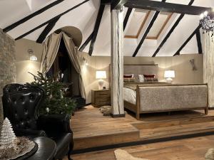 a bedroom with a bed and a christmas tree in it at Relax in Style Boutique Hotel in Braşov