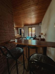 a dining room with a table and chairs at Complejo La Yema in Miramar