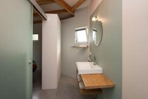 a bathroom with a sink and a mirror at Silo 161 in Ruinerwold +96 photos