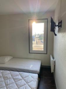 Giường trong phòng chung tại hotel barbery