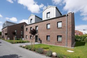 a brick building with two towers on top of it at Dahmer Strand 5 in Dahme