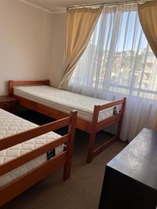 En eller flere senge i et værelse på One minute from the Vinadel Mar bus terminal