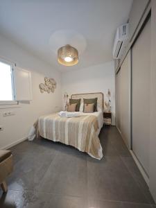 Postel nebo postele na pokoji v ubytování Apartamento El Tanguillo Little Apartments