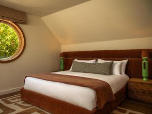 Postel nebo postele na pokoji v ubytování Botany House Boutique Retreat