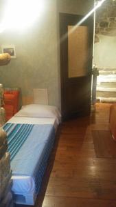 Postel nebo postele na pokoji v ubytování B&B Da Marta