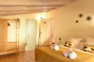 a bedroom with two beds with white pillows at B&B Can Jan in Sant Ferriol
