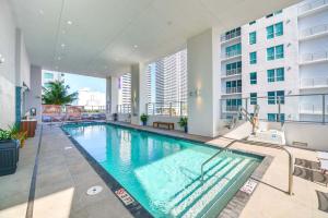 a large swimming pool in the middle of a building at Stylish Studio in Brickell Core in Miami