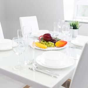 a white table with a plate of fruit on it at Modern Two Bed Apartment - Netflix - Balcony - Parking - 5MC in Birmingham