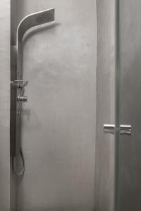 a shower stall in a bathroom with a shower head at Melitia Traditional House in Koskinou +18 photos