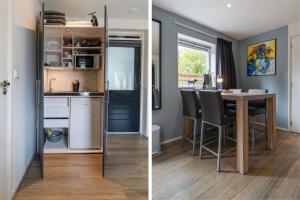 a kitchen and a dining room with a table at Bed and breakfast Stiens in Stiens +2 photos