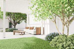 a living room with a white couch and a table at Pavì Trulli e Suites in Locorotondo
