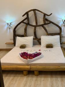 Giường trong phòng chung tại Cholobandas