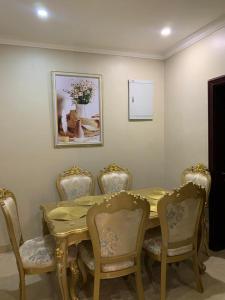 a dining room with a table and chairs at Gracepointapartments in Lekki