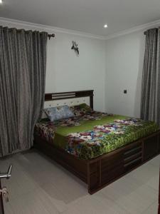 a bedroom with a bed in a room at Gracepointapartments in Lekki