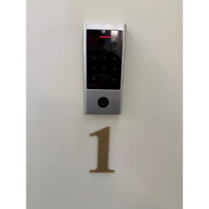 a clock with the number one on a wall at Piazza Duomo Guest House in Ariano Irpino