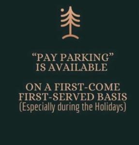 a sign that says pay parking is available on a first come first served basis at 2BR Burnham Hill Condominium in Baguio