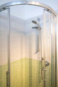 a shower with a glass door in a bathroom at M377 - Marcelli, bilocale con corte esterna e posto auto in Marcelli +14 photos