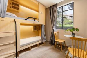 Giường trong phòng chung tại Guangzhou Oulan International Hotel-Near Canton Fair And Canton Tower And Free Night Snack Provided