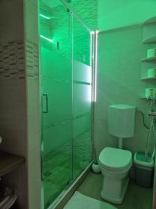 a bathroom with a toilet and a glass shower at Bellavista Bilocale in Foligno +8 photos