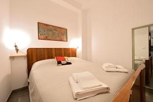 En eller flere senge i et værelse på Il Cavalliere Bed & breakfast