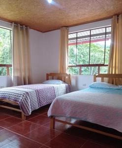 Giường trong phòng chung tại Hospedaje Casablanca