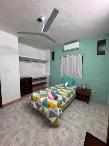 a bedroom with a bed and a ceiling at Casa X-lapac in Valladolid