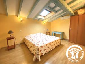 a bedroom with a bed in a room at La cave de jean in Gardie