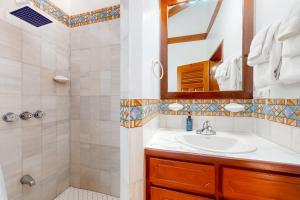 a bathroom with a sink and a shower at Poseidon House in Riversdale +59 photos