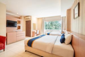 Postel nebo postele na pokoji v ubytování Sweet Karina Hotel Pasteur + 59 fotografií