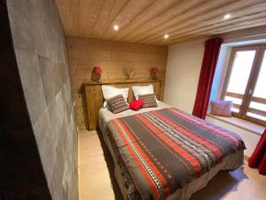 a bedroom with a bed in a log cabin at Cal xiquet in Bolquere Pyrenees 2000