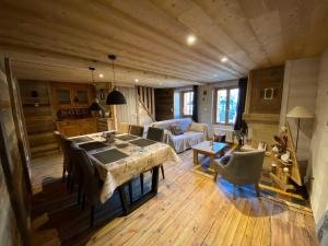 a living room with a table and a couch at Cal xiquet in Bolquere Pyrenees 2000