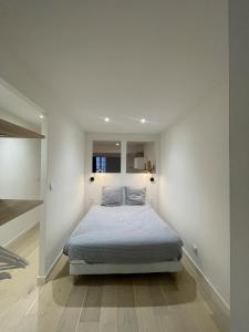 Giường trong phòng chung tại L'appartement du centre - Hypercentre - Lavaur