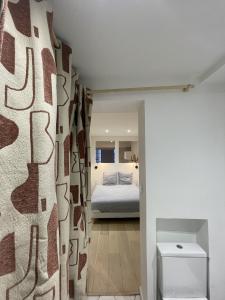 Giường trong phòng chung tại L'appartement du centre - Hypercentre - Lavaur