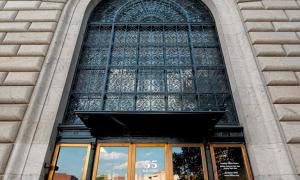 a large window in a building with a large window at Landing Apartments - The 55 Elm Club in Hartford +2 photos