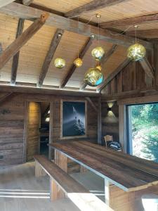 a room with a tv and a wooden ceiling at Chalet de ZORE in Morzine