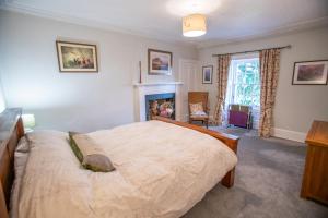 En eller flere senge i et værelse på Wester Campsie Farm House