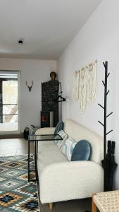 a living room with a couch and a glass table at Molfar in Yasinya