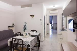 a living room with a table and a couch at Cairoly Residence in Termoli